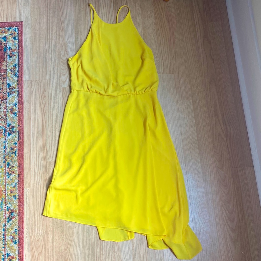 Yellow draped dress.